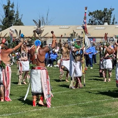 Traditional dancers gathered in ceremony and community celebration